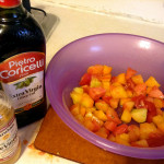 Dressing tomatoes in olive oil and rice wine vinegar